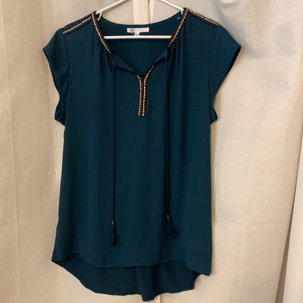 Deep Teal colored blouse.